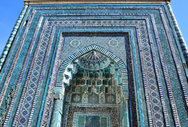 a tall building with a blue and white design on it