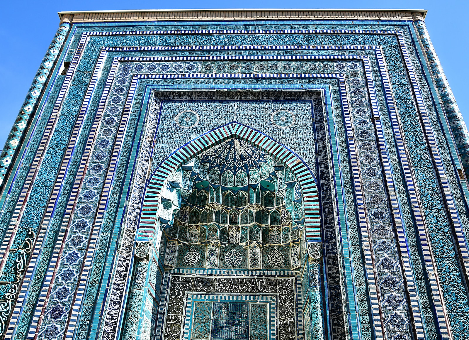 a tall building with a blue and white design on it